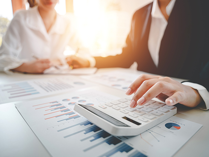 Professional reviewing actuarial charts