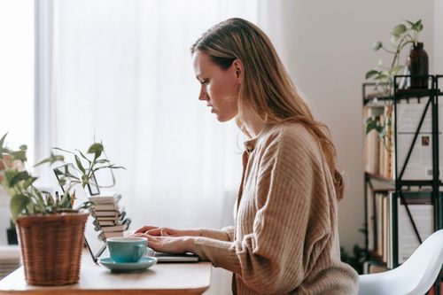 Freelancer working remotely on laptop
