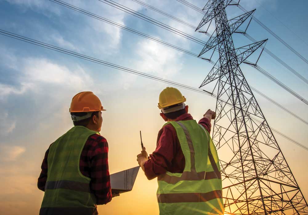 Electrical engineer working on equipment