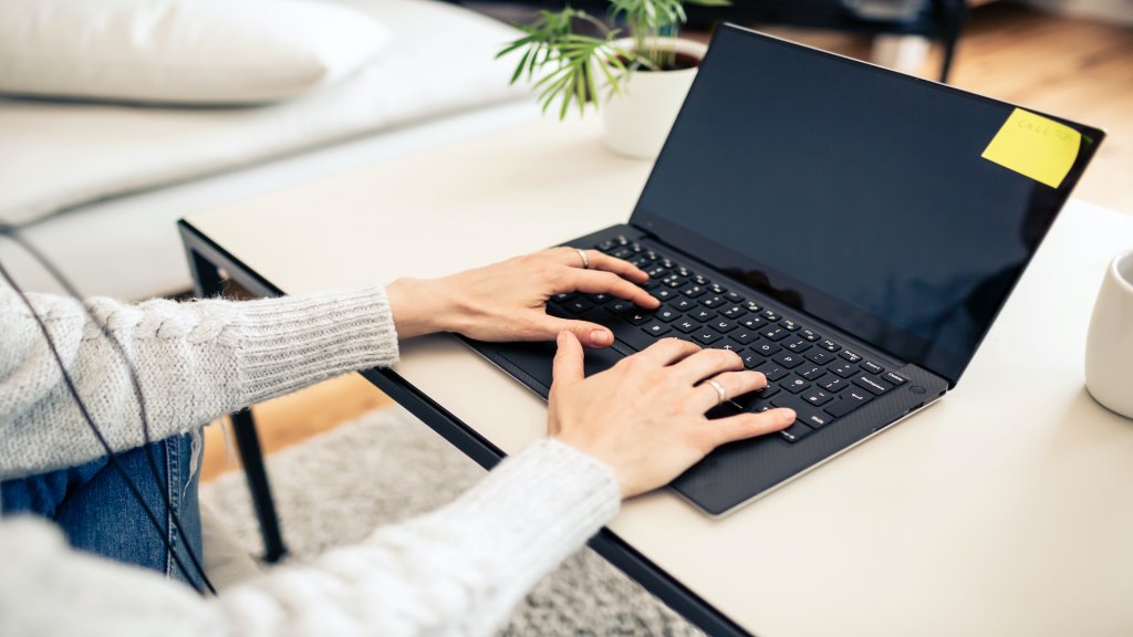 Person working from home on a laptop computer