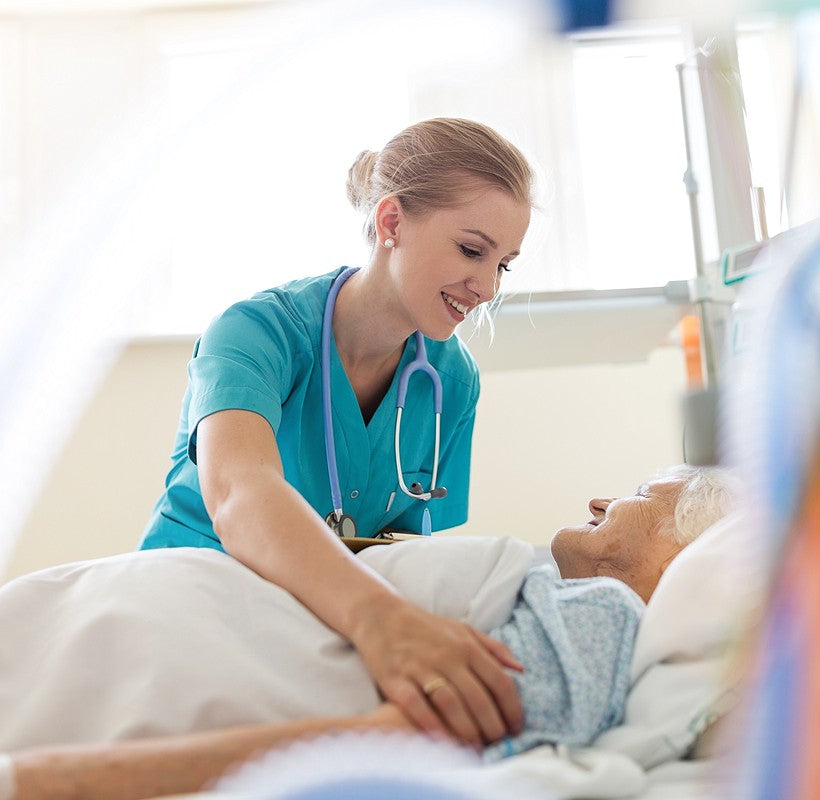 Nurse caring for an elderly patient