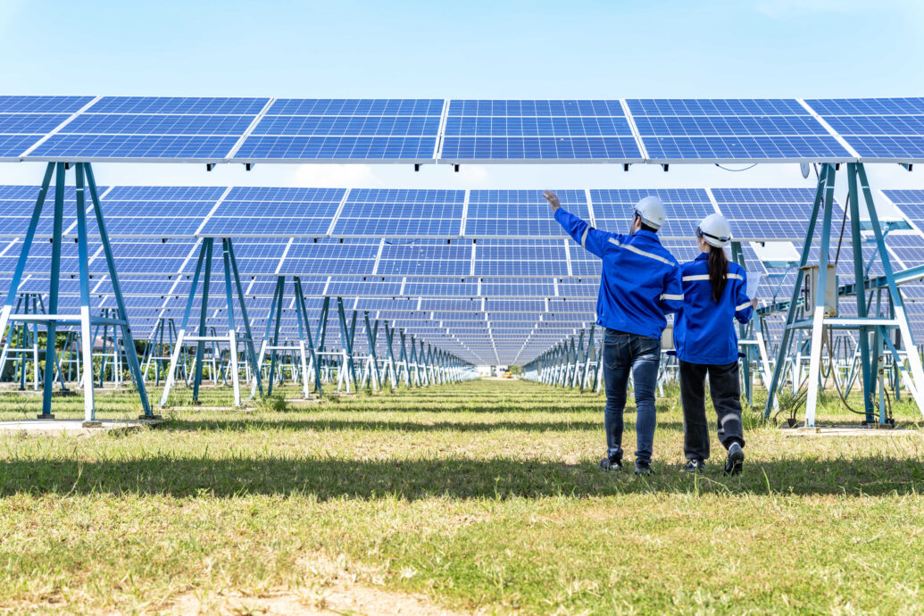 engineers inspecting solar farm